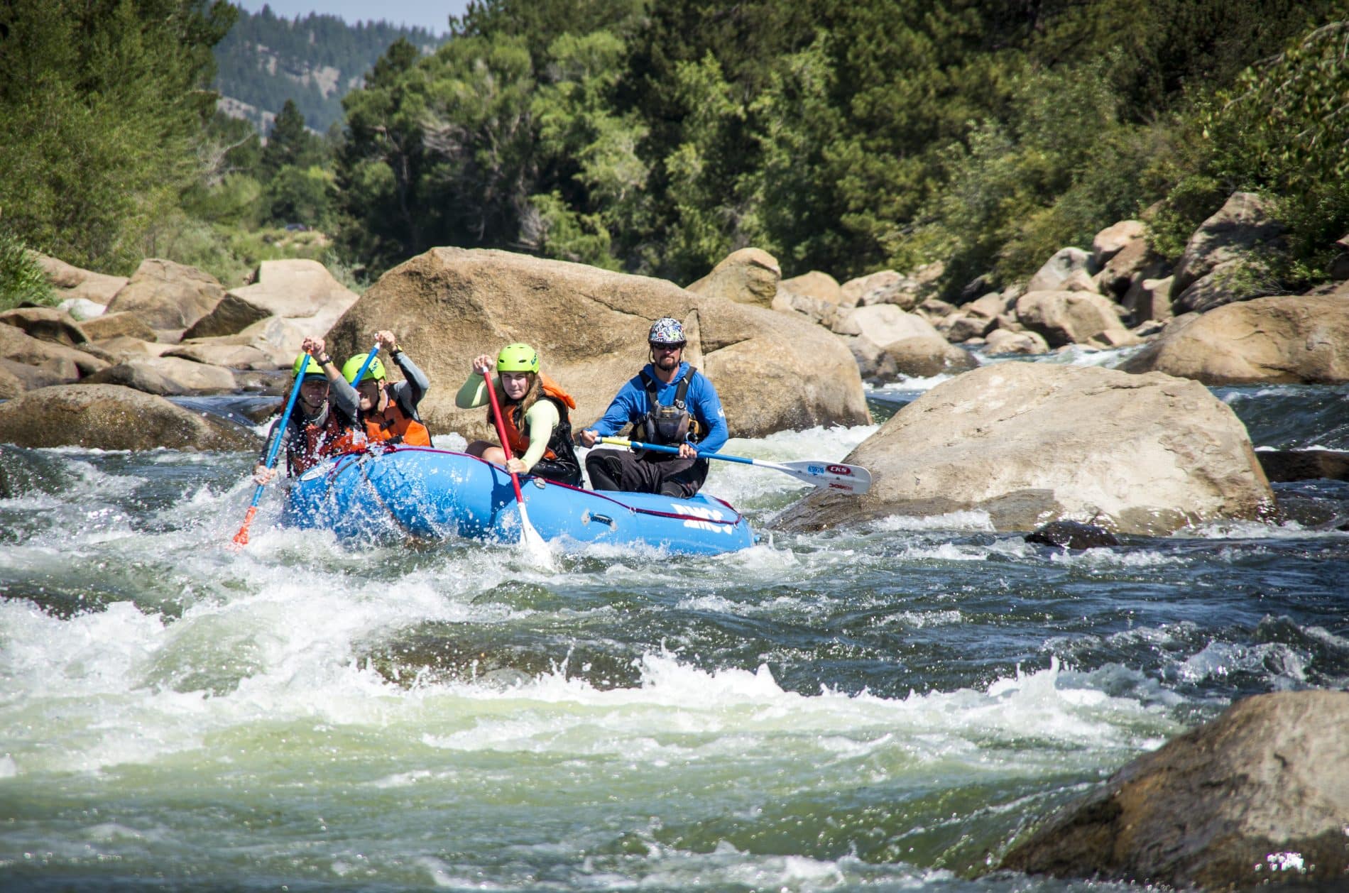 Raft on the river with large boulders