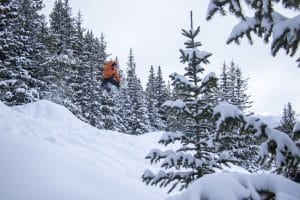 snowboarder going off a jump