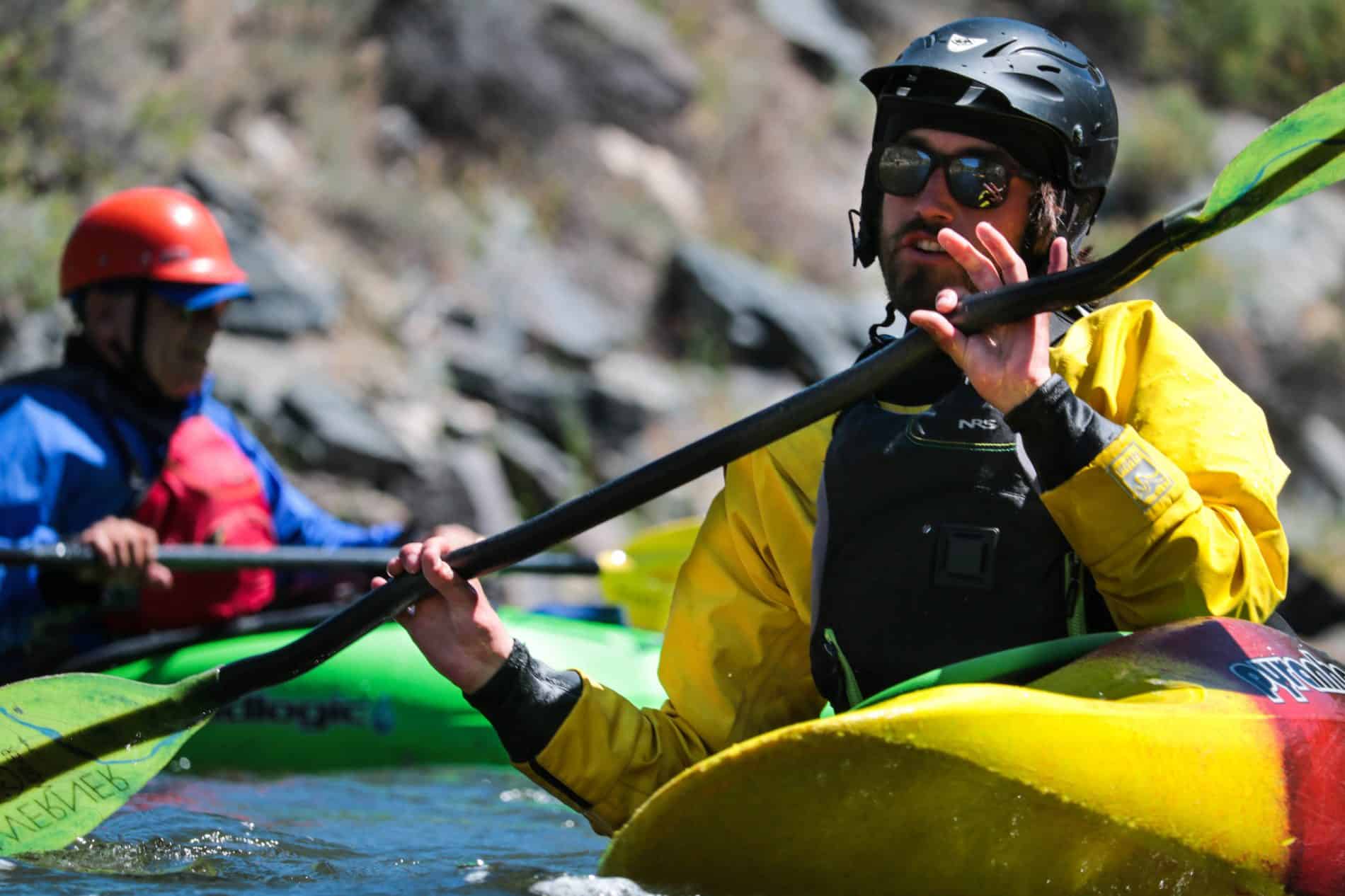 A kayaker practicing his grip in a kayak