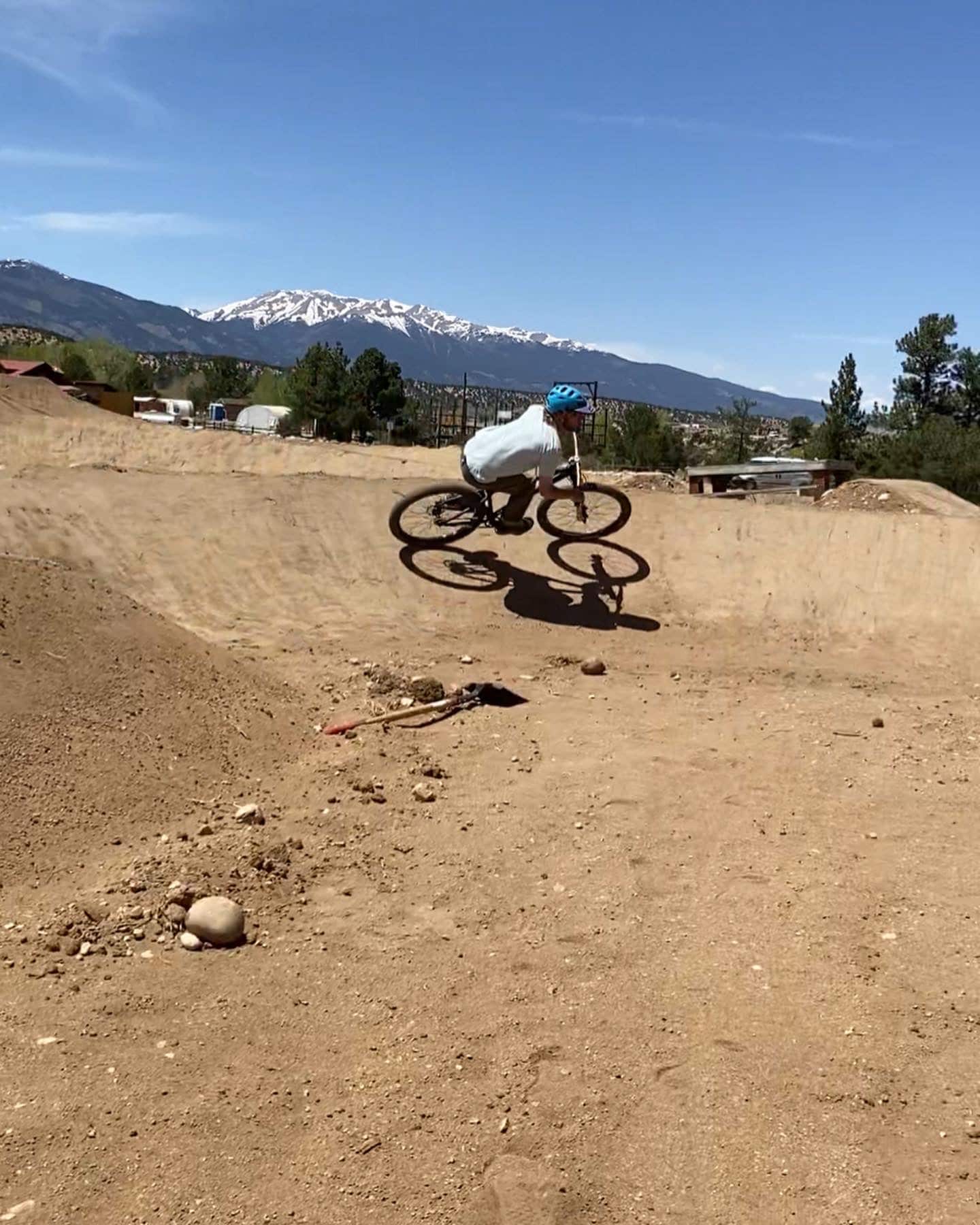 Person biking on a dirt course