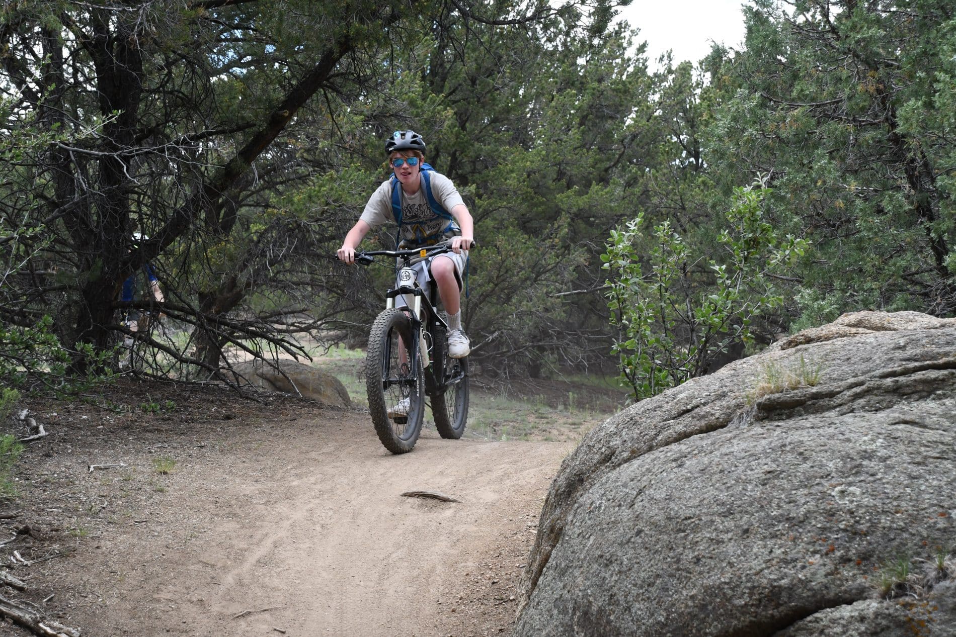 Person biking on a gravel path