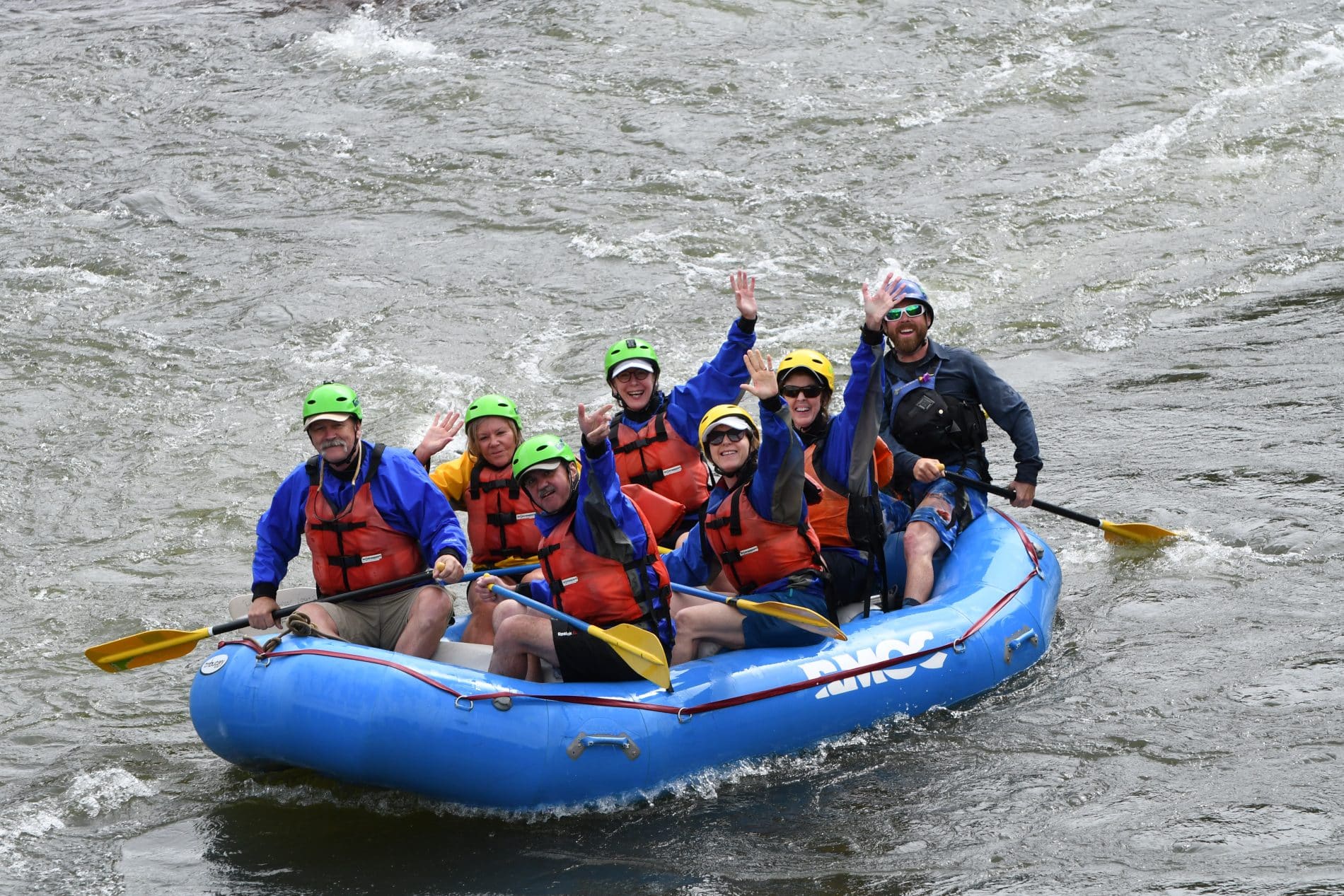 Group waving from a raft