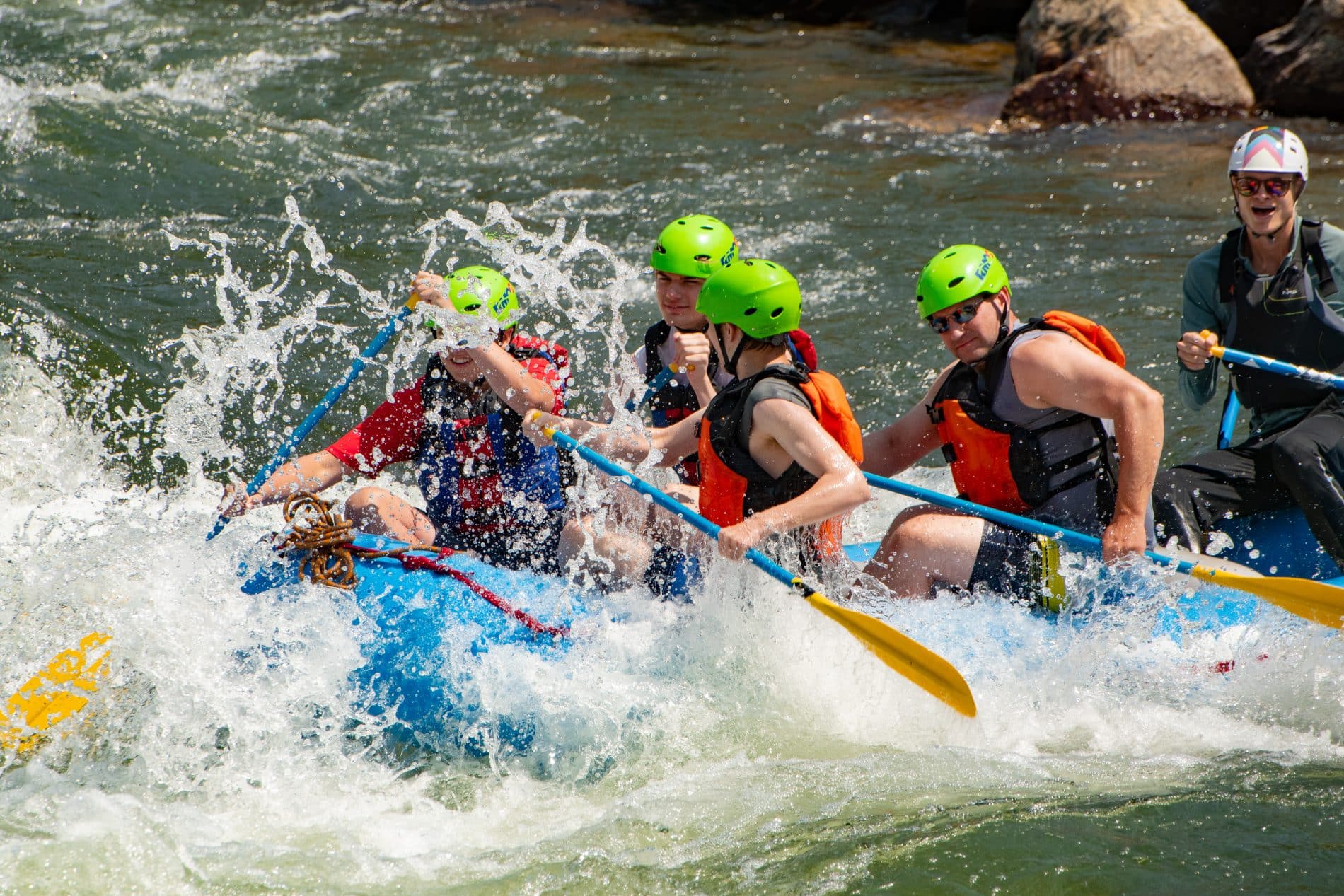 Family rafting in helmets