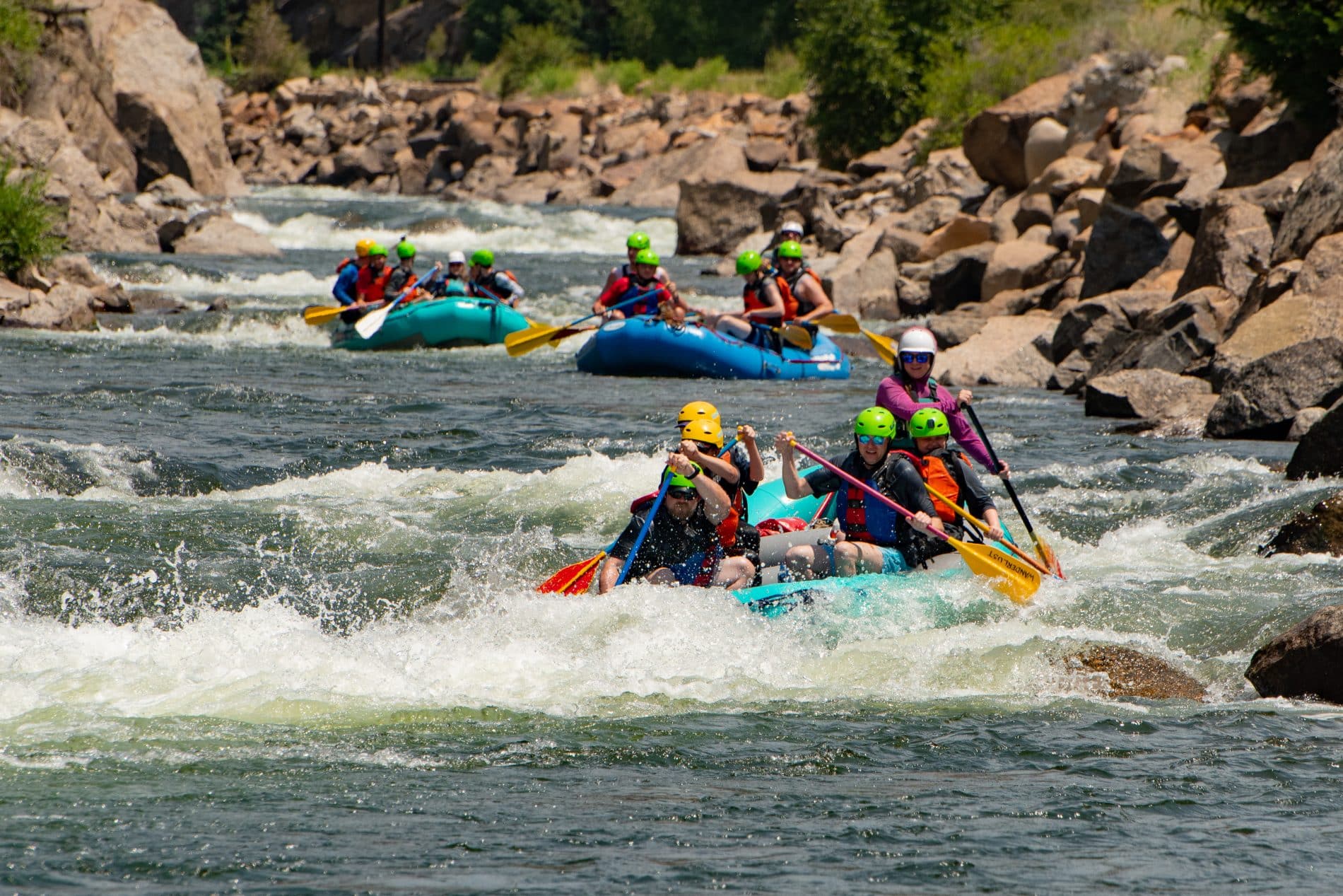 3 rafts going down the river