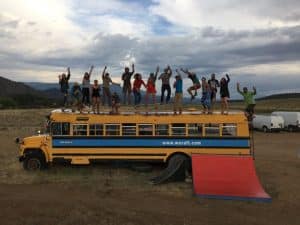 People celebrating on top of a bus
