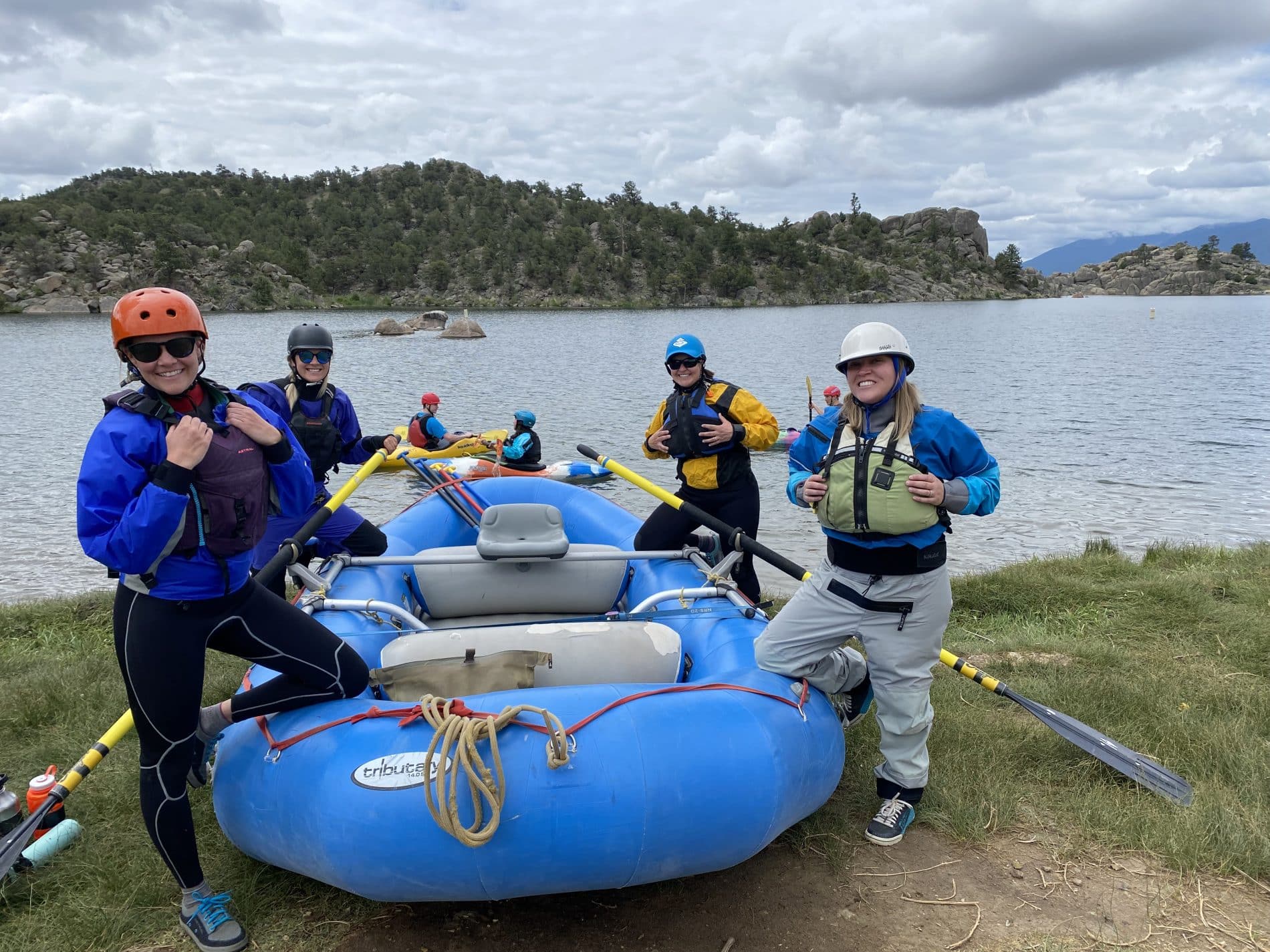 Group standing by raft