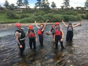 People wading in a river