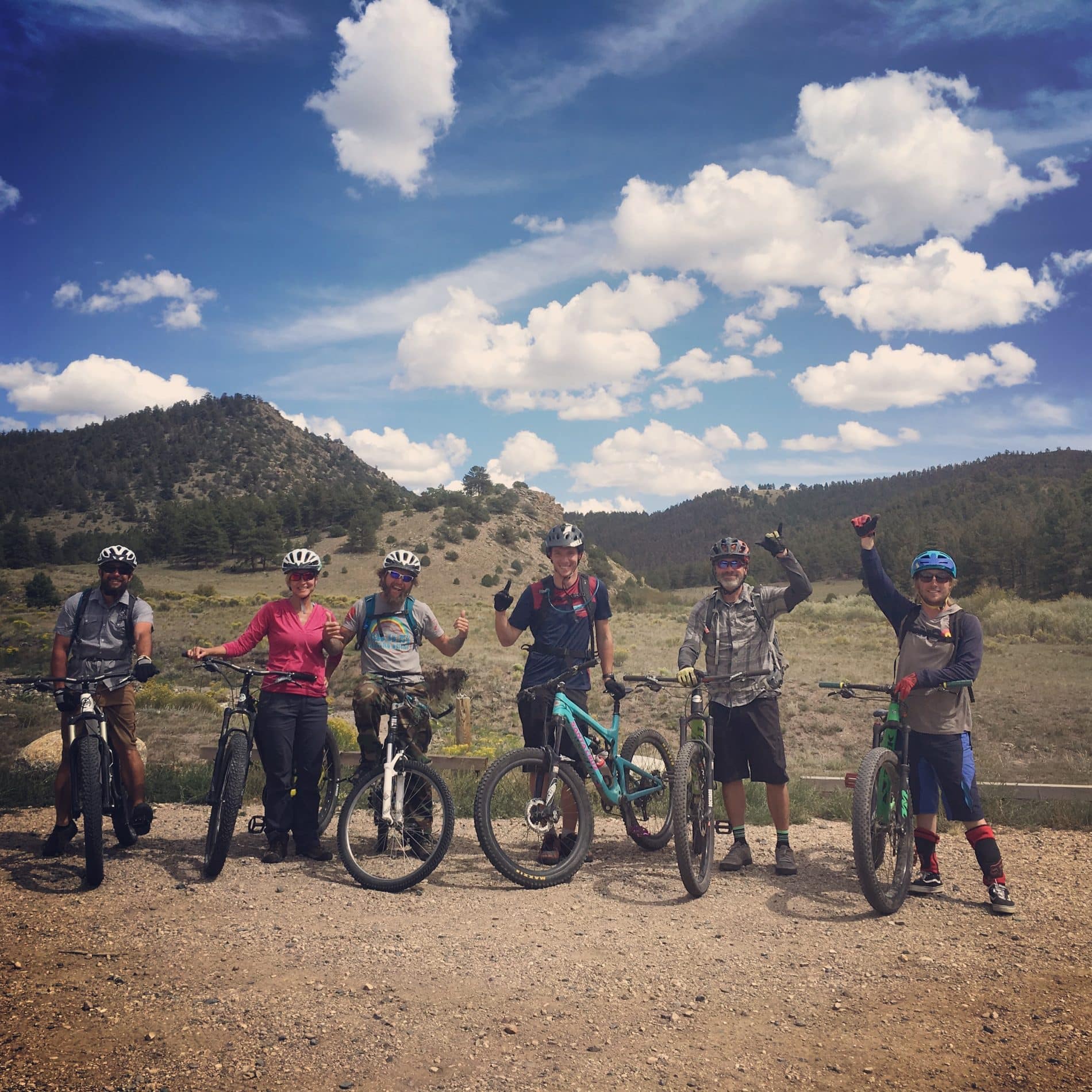 Group of people posing with their bikes