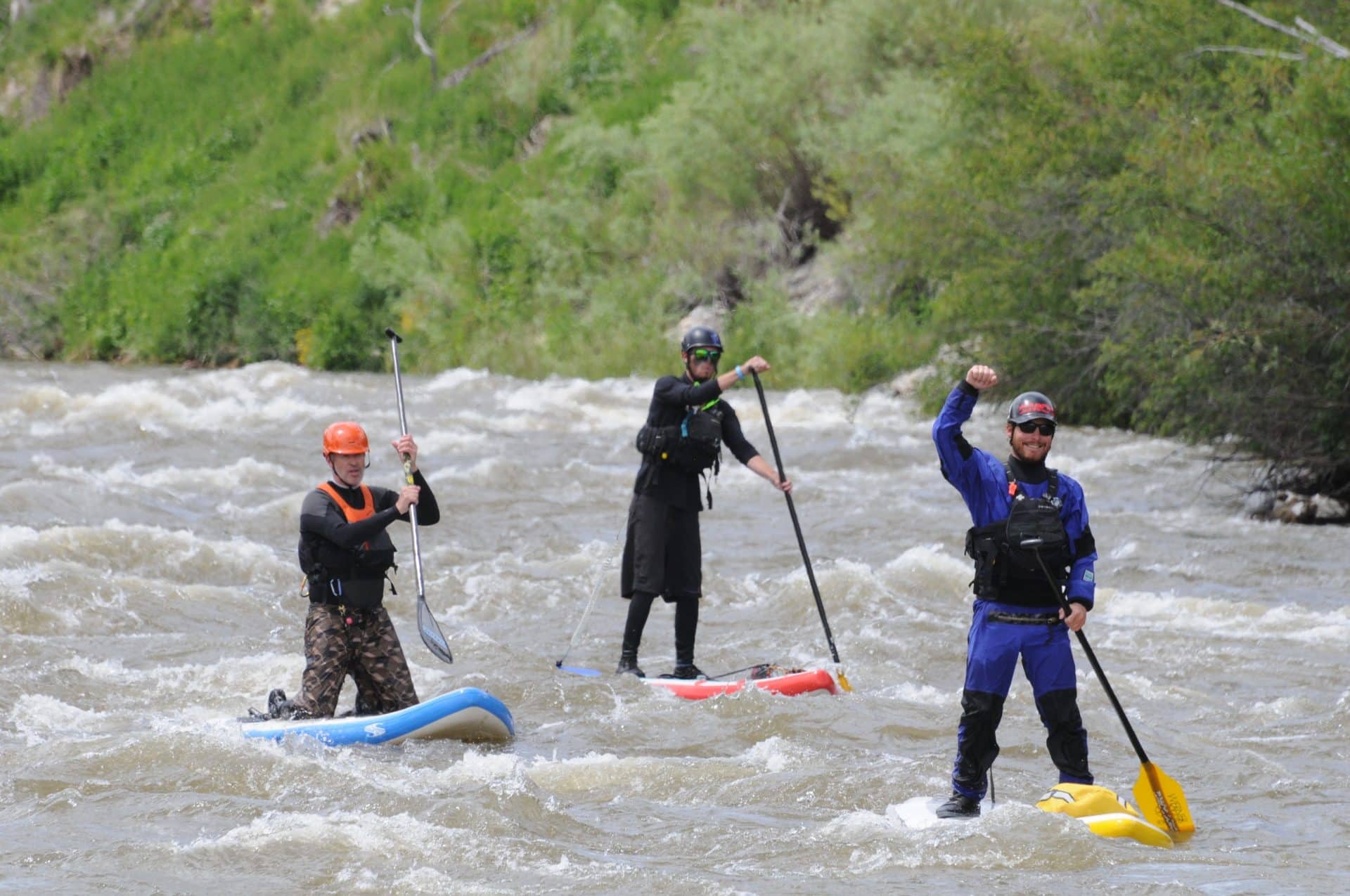 3 people paddleboarding