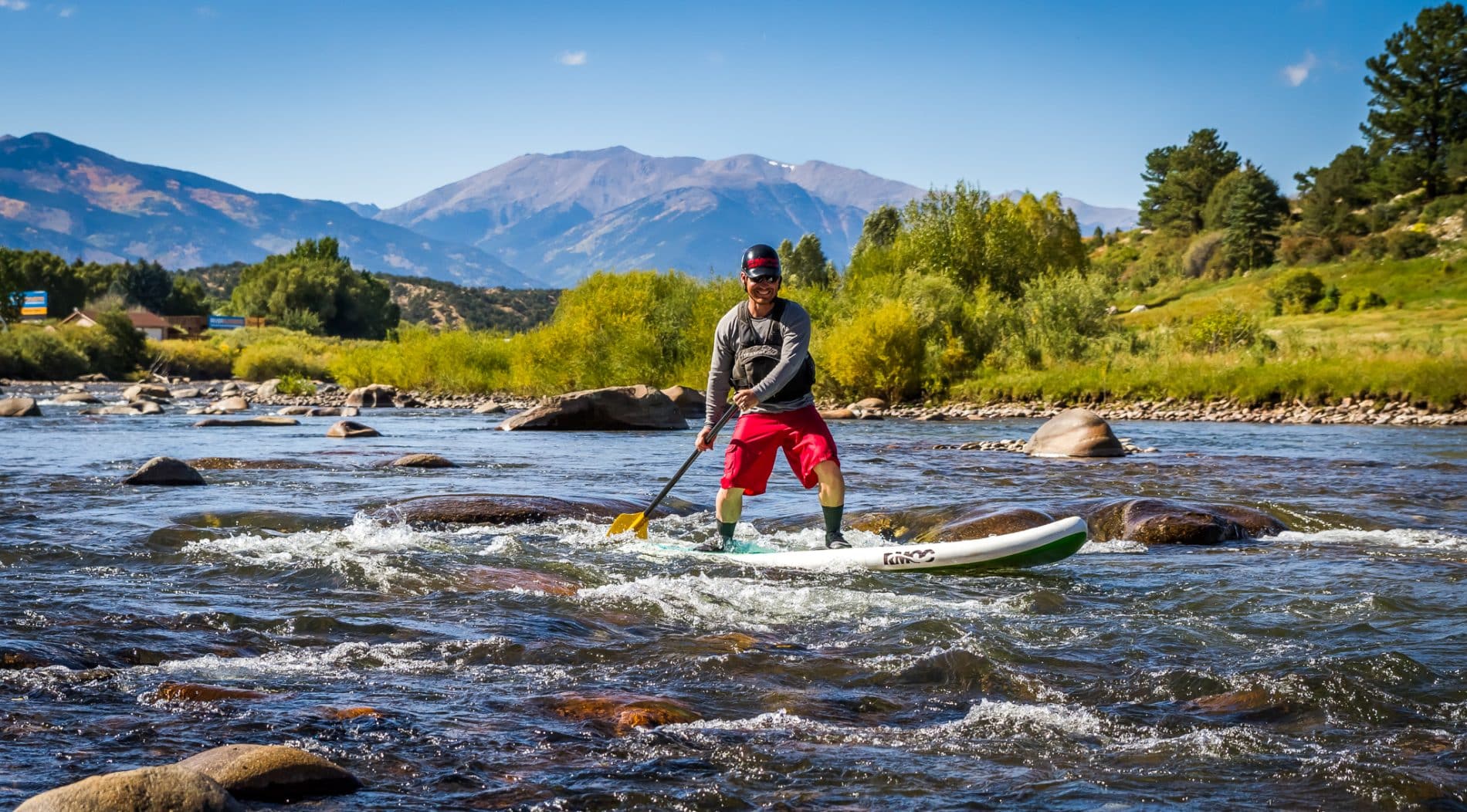 Paddleboarding through small rapids