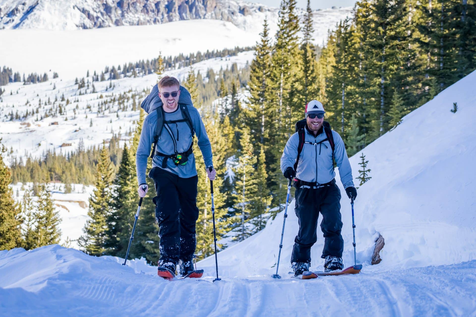 Two people backcountry skiing