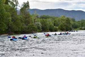 Line of inflatable kayakers
