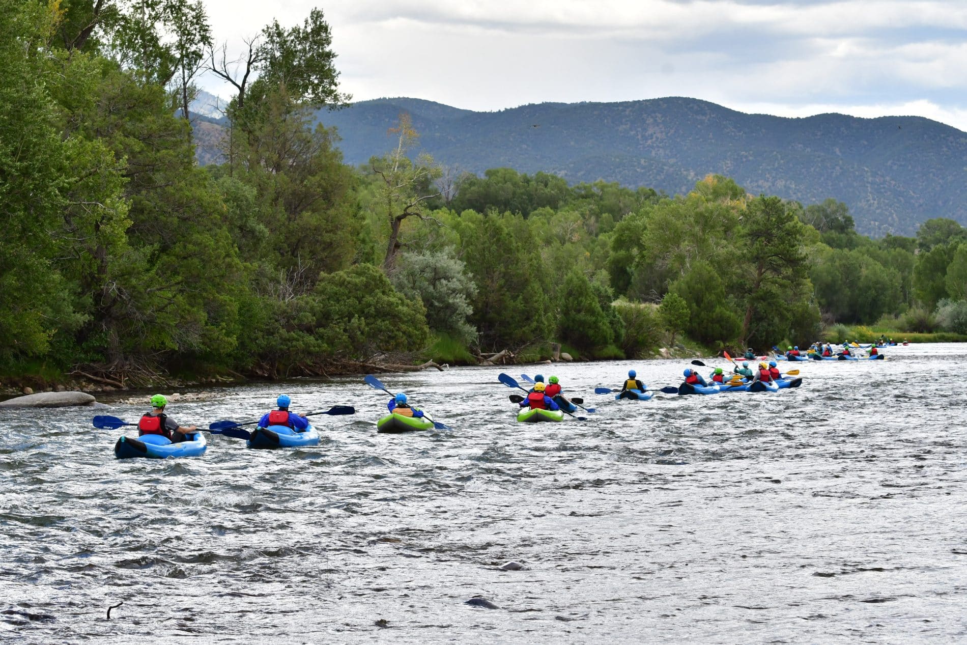 Line of inflatable kayakers
