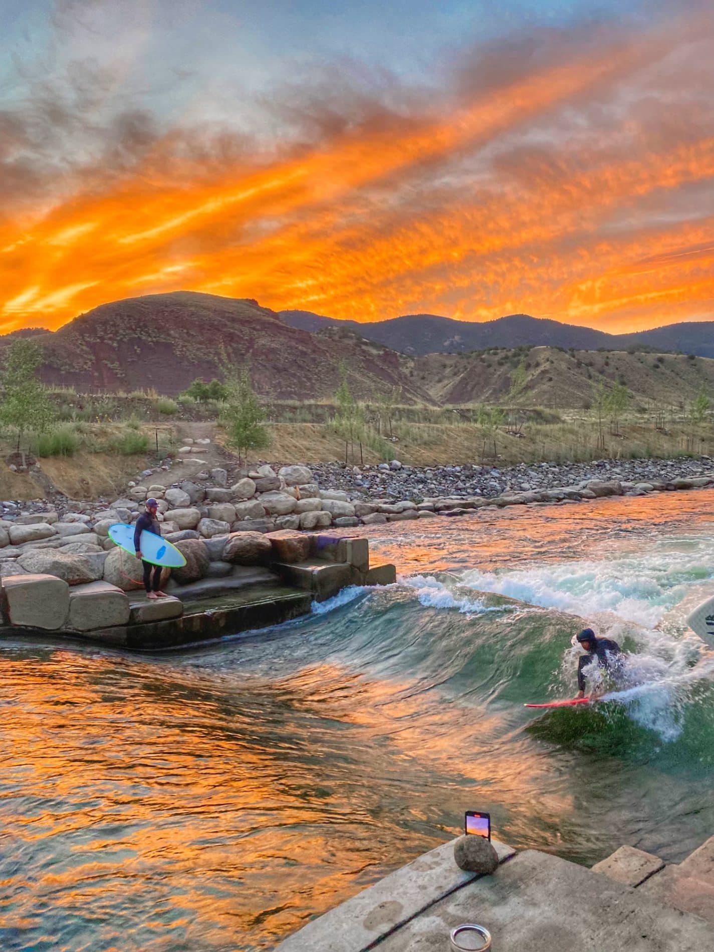 River surfing at sunset
