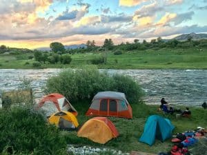 A group of tents by a river